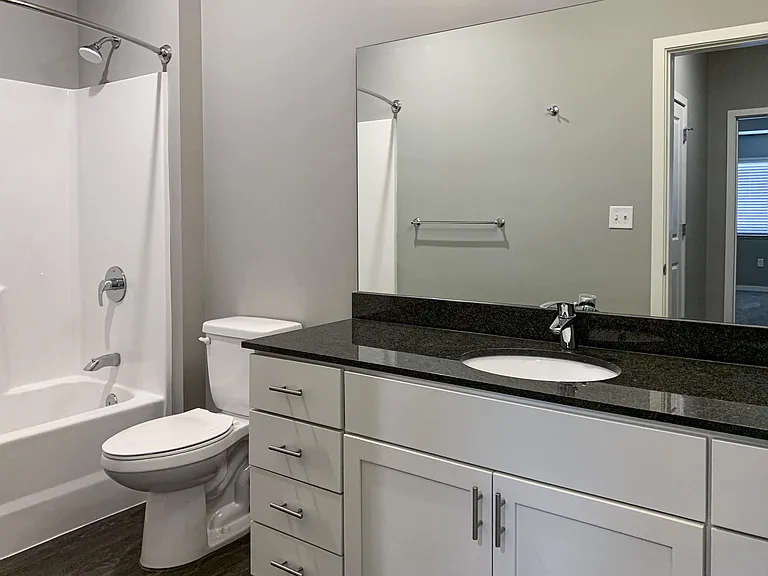 Our modern bathrooms feature sleek finishes and ample storage to make your daily routine comfortable and efficient.