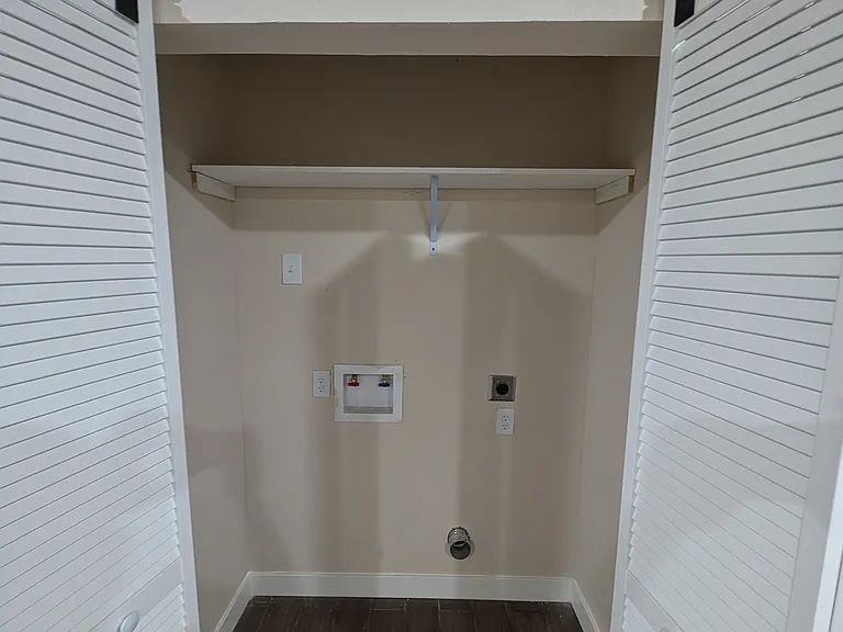 Washer dryer Area with convenient access to living areas.