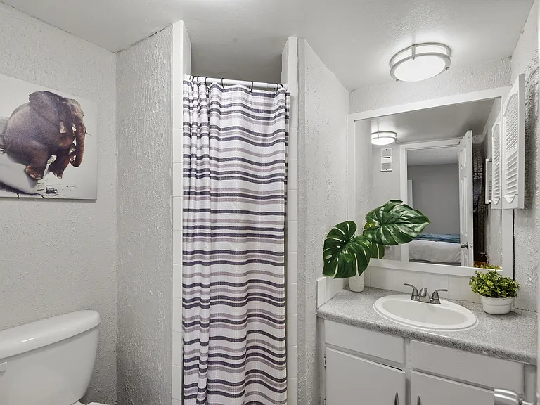 Welcome to Wymore 360 Apartments, where modern design meets functionality. Enjoy a stylish bathroom featuring sleek fixtures and a cozy ambiance. Make this inviting space your own today. Schedule a tour and see all that awaits!