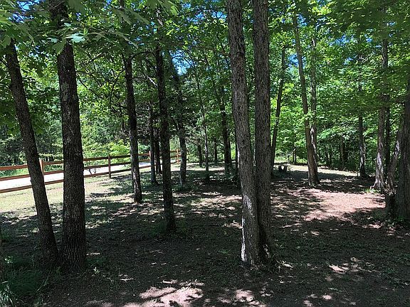 Left of driveway entry