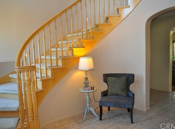 Grand foyer with magnificent curved staircase.