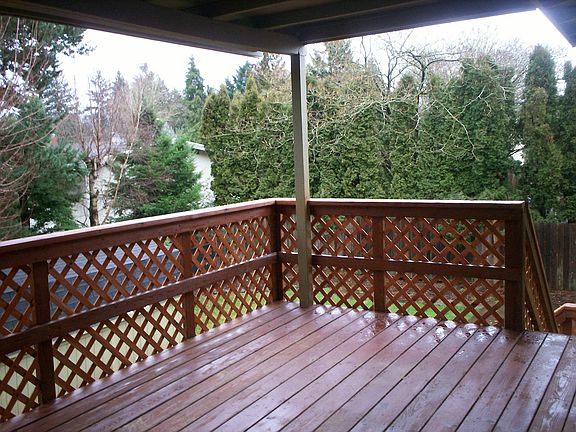Covered Deck With Stairs to Backyard..Right off the Kitchen/Dining Room 