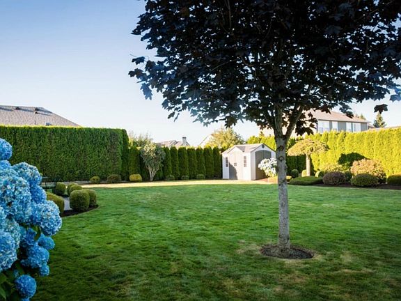 Very private backyard at over 1/4 acre with storage shed