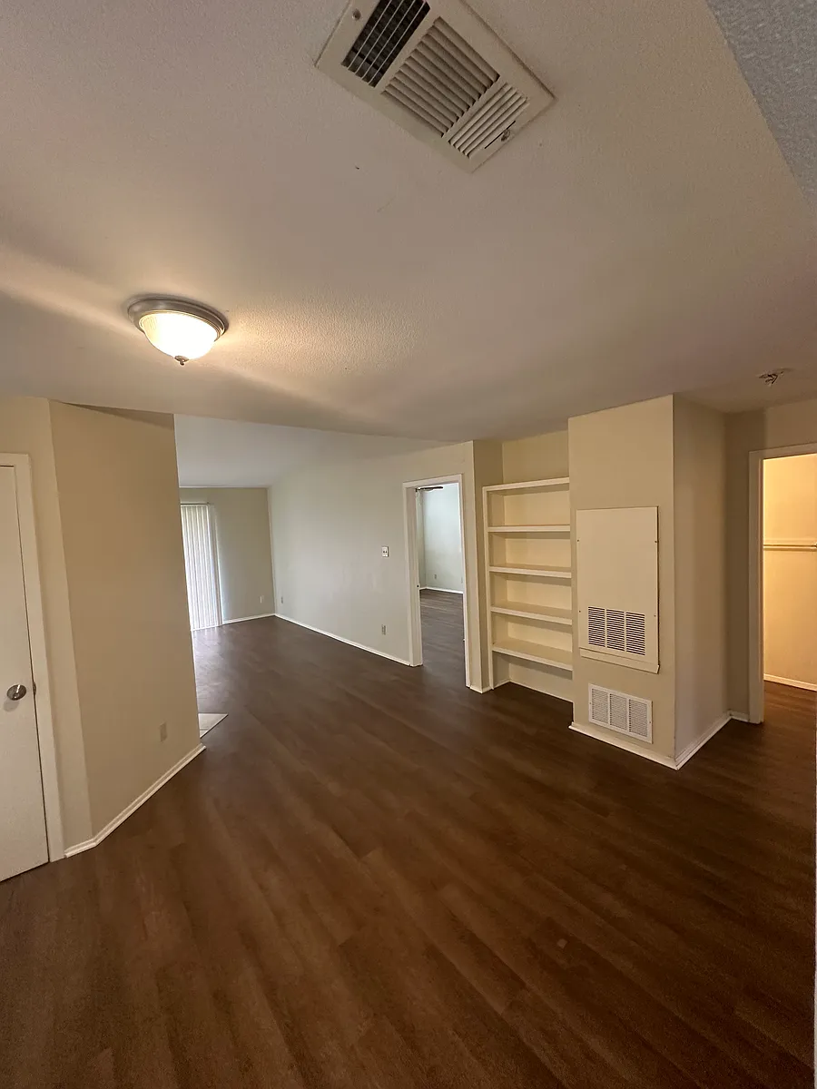 High ceiling, bookshelf, storage closet, luxury vinyl flooring - 2012 W Loop #C