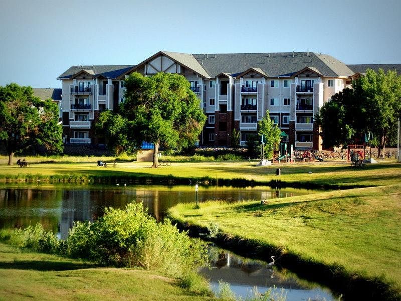Outside of building, backs onto park and lake. Condominium building built 2006