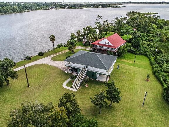 Areial View overlooking the river. Plenty of room for a pool and outdoor activities.