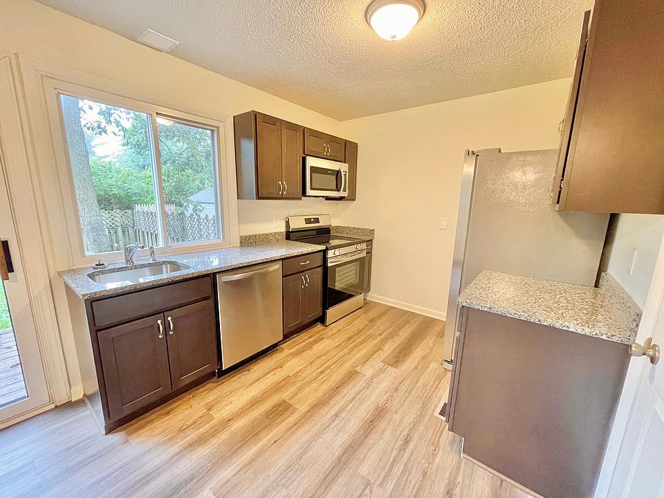 Kitchen with microwave, fridge, stove and dishwasher
