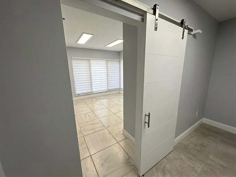 Barn Door Entry to Same Room
Stylish sliding barn door entry adds a modern designer touch to this versatile flex room