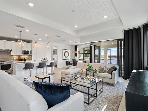 Model Representation Open flow-through layout with decorative tray ceiling