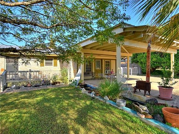 Tranquil front yard with deck & water feature