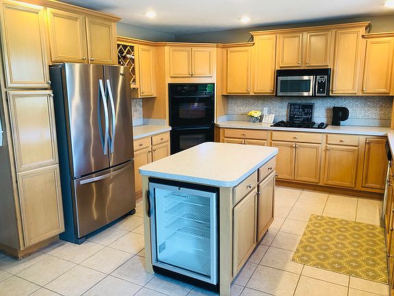 Tile floors. Maple cabinets.
