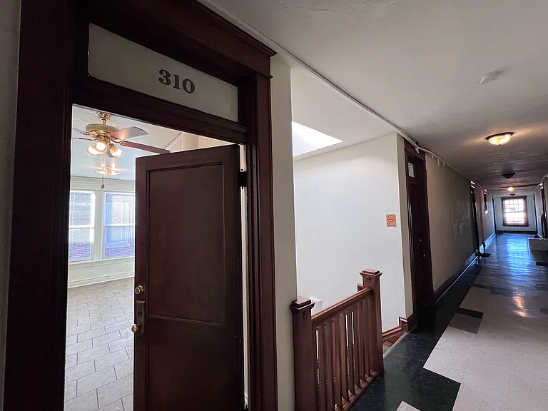 Entering the unit from the hallway. The entry door is located right off of the back stairwell.