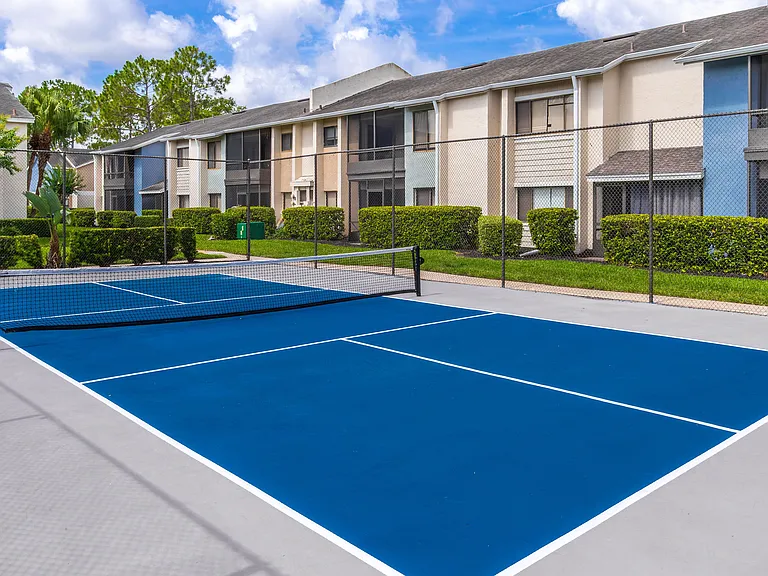 Experience resort-style living at Harper Grand Apartments with access to outdoor recreation including our vibrant pickleball court, perfect for players of all skill levels.