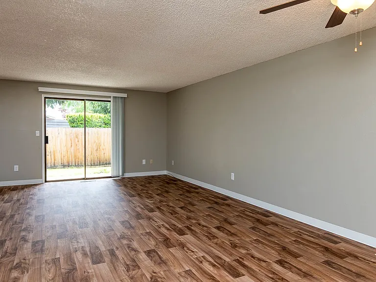 Spacious Living Room with Wood-Inspired Vinyl Flooring