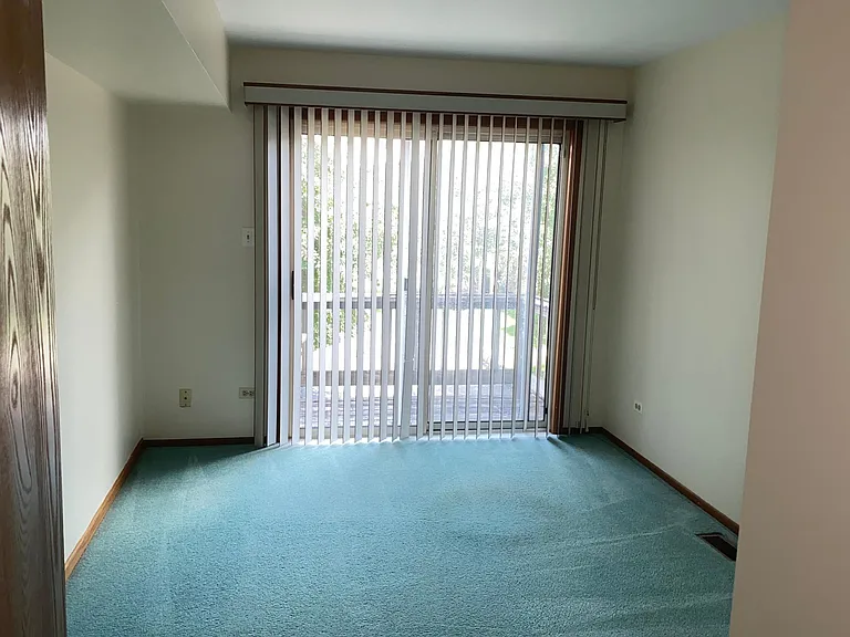 2nd bedroom with balcony.