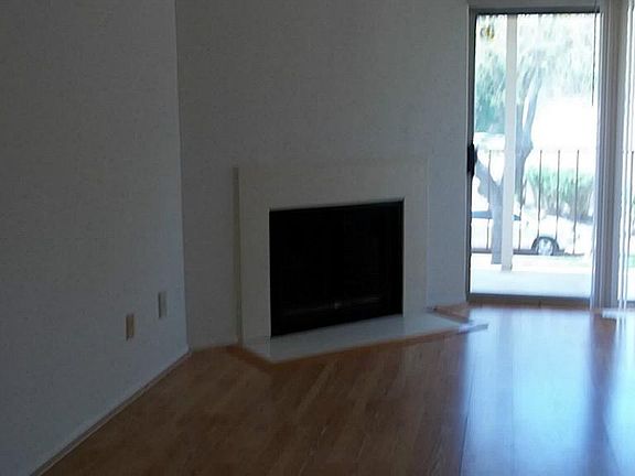 LIVING ROOM WITH WOOD BURNING FIREPLACE