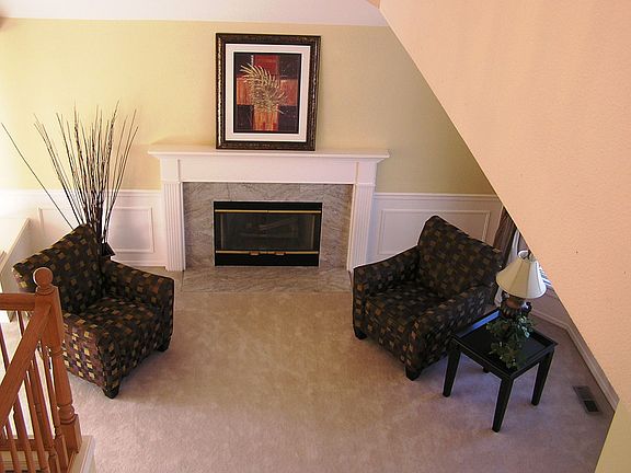 Looking down into the living room from above stairwell