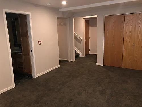 Basement bedroom/flex room with storage and laundry room with washer/dryer