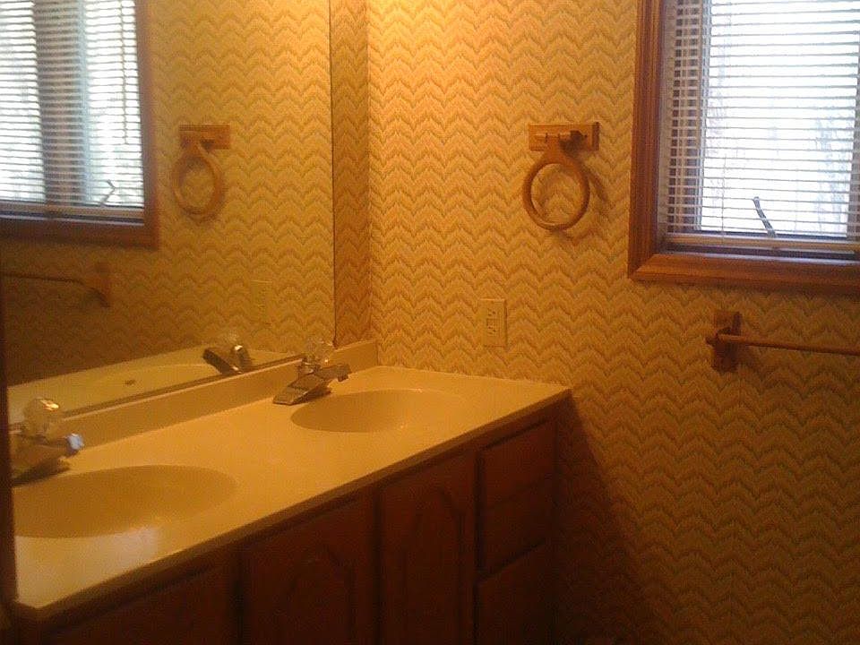 Upstairs full bathroom with double sinks 