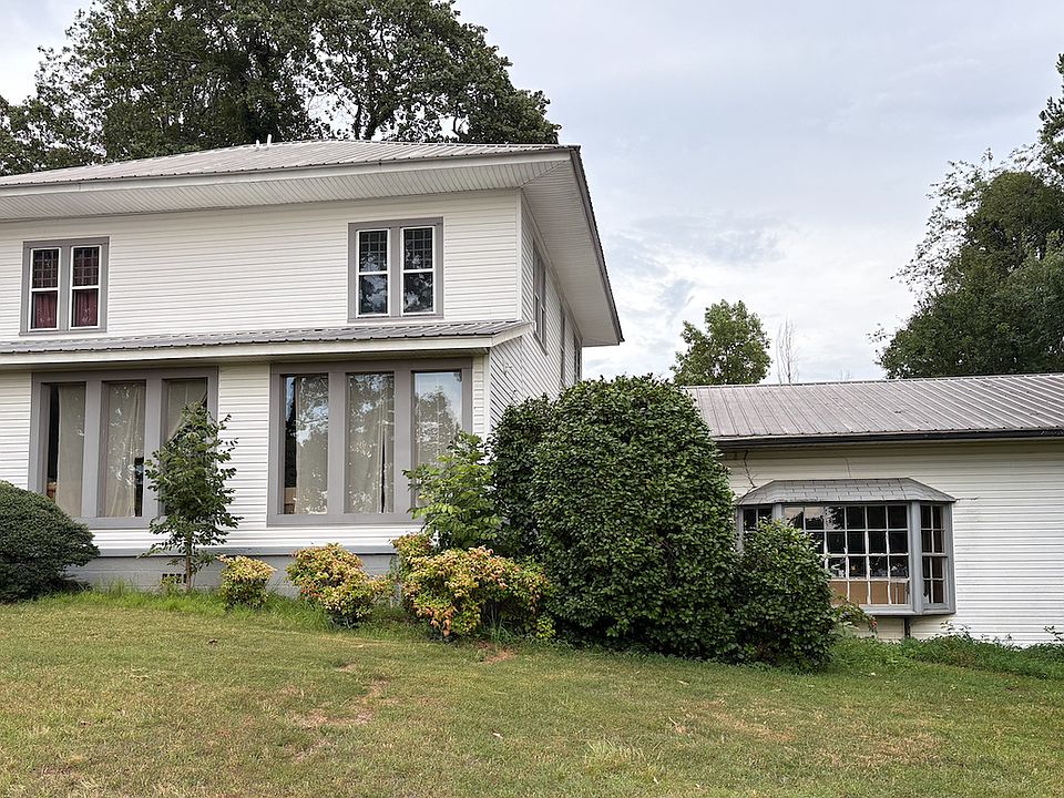 Rental is the space with the bay window to the right side of the main house.
