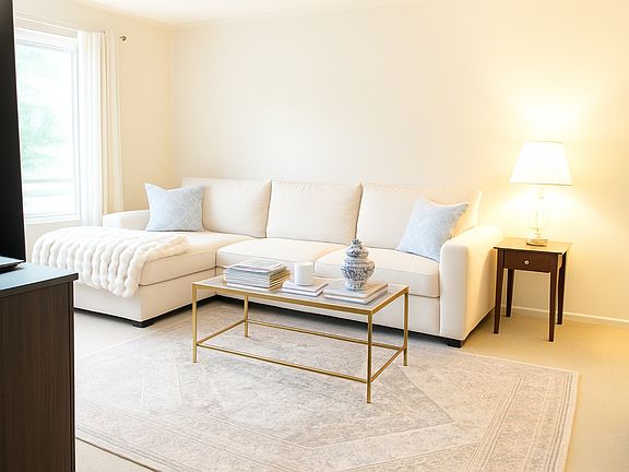 very roomy with a fire place, window and access to the balcony .