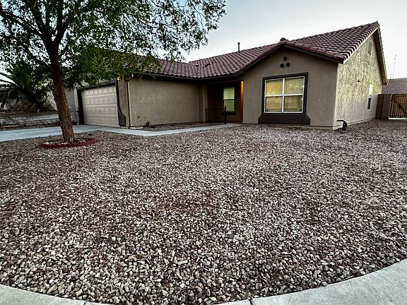 Spacious corner lot with clean landscaping and a fresh, modern exterior.