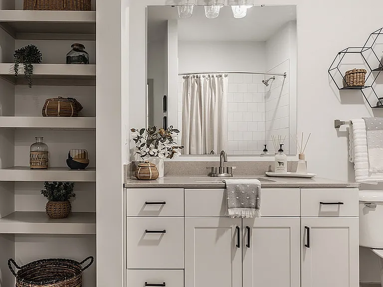 Bathrooms offer sophisticated design, ample lighting, and plenty of storage to keep your space beautiful.