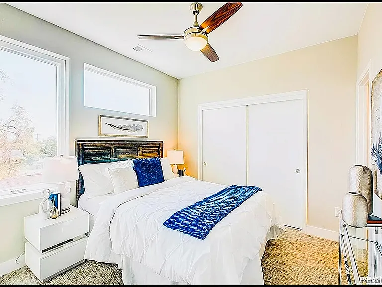 Experience tranquility in this bright bedroom haven, featuring modern furnishings and abundant natural light.