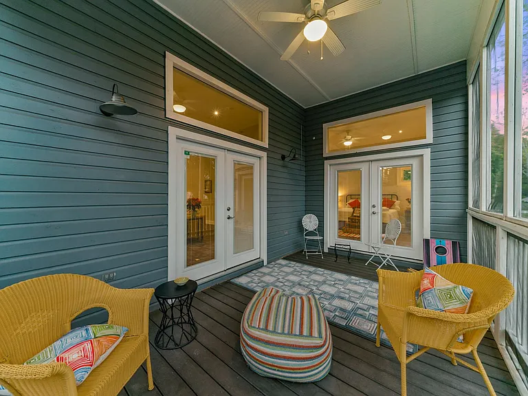 Screened in porch adjacent to both the living room and the master bedroom.