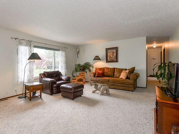 Spacious living room with beautiful sunsets.