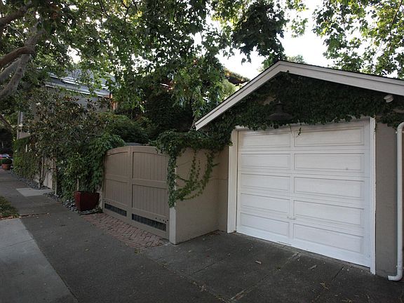 Detached garage and gated driveway.