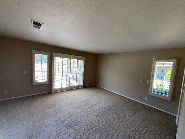 Master bedroom with view of golf course (picture looks darker than in real life)