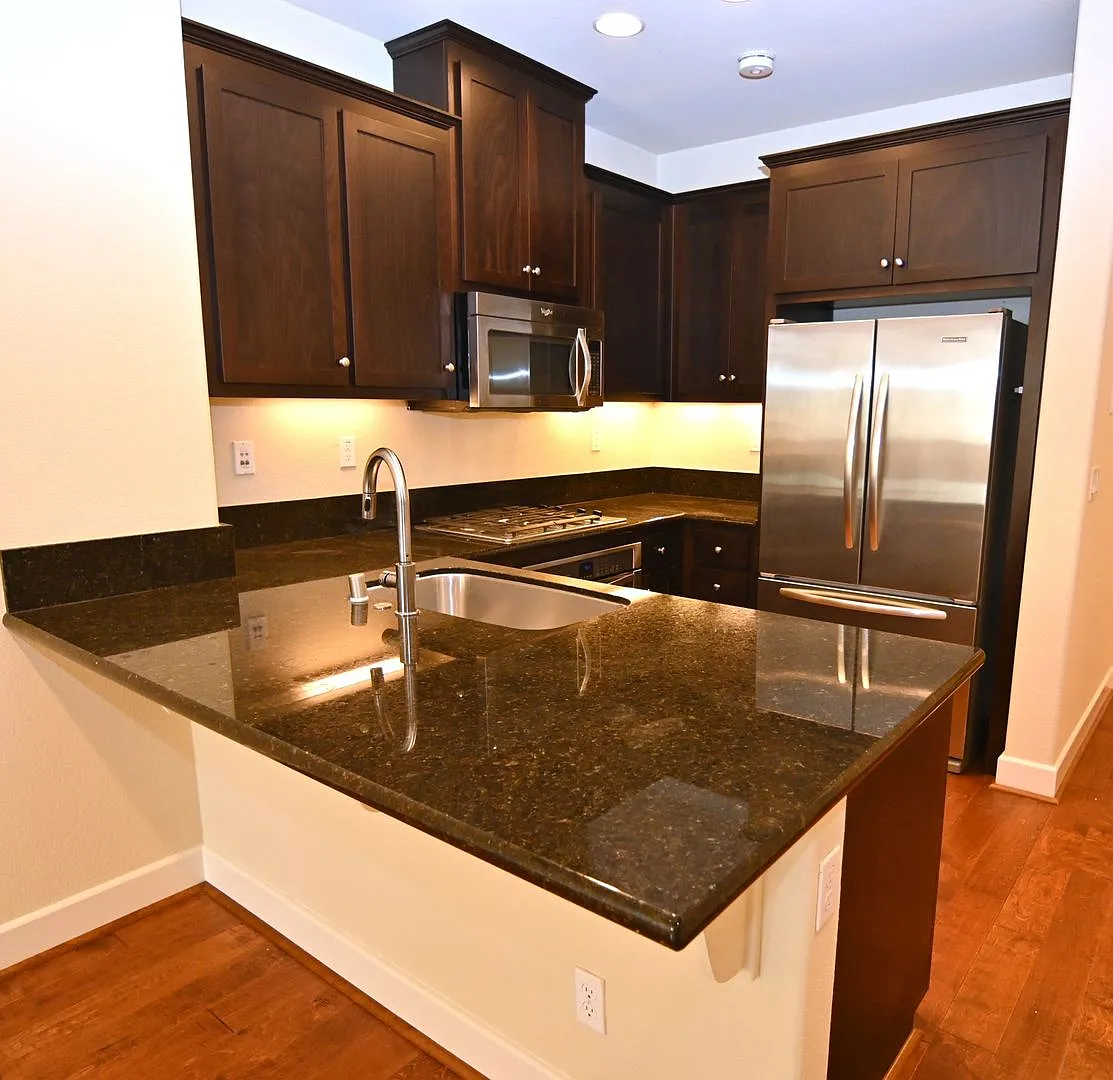 Sleek Tri-Level Townhome with Modern Upgrades and Top Ammenities - Tralee Village — Photo 2