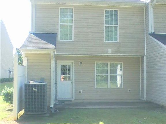 Private back area bordered by woods