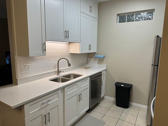 New kitchen with granite countertops and stainless appliances