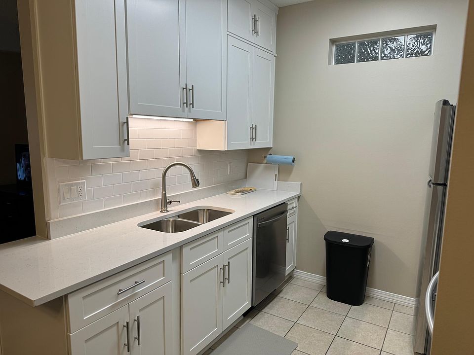 New kitchen with granite countertops and stainless appliances