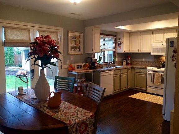 Kitchen with double door and view of backyard