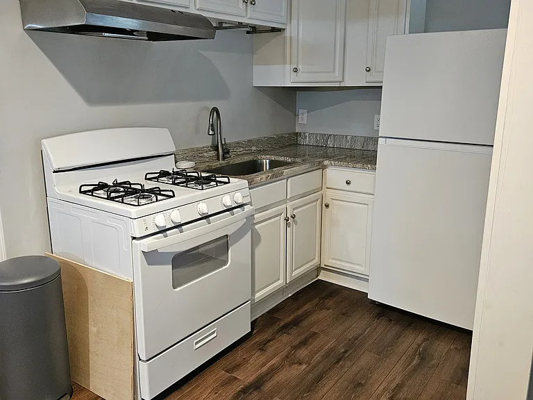 Kitchen with brand new gas stove and refrigerator