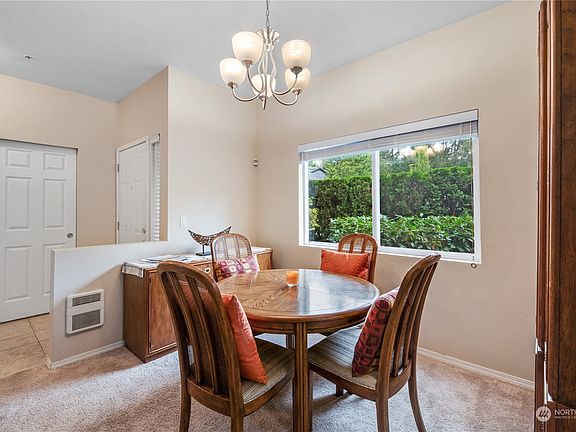 The dining room is open to the kitchen making for easy access when entertaining and creating an open space for all to connect. Notice the double-wide guest closet to the left.>