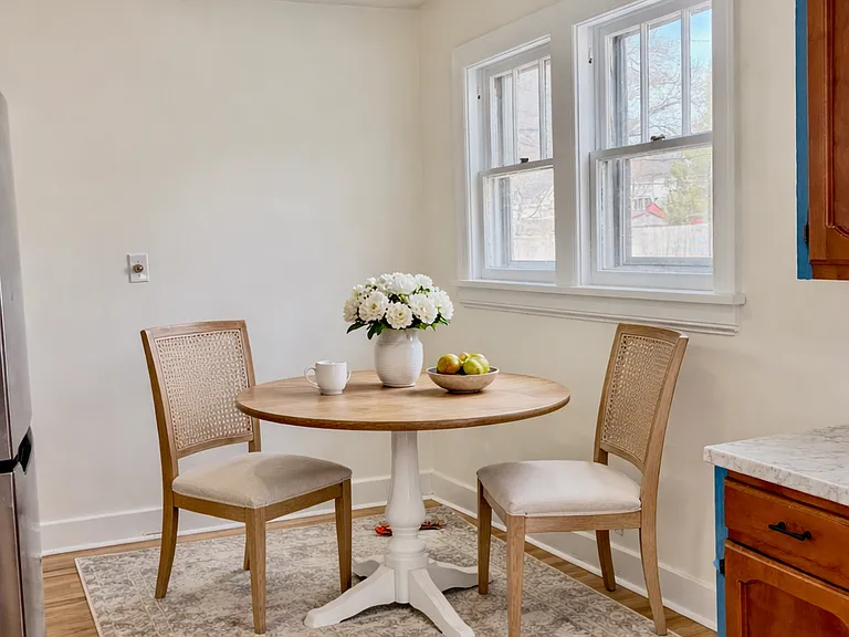 Virtually staged photo of eat in area.
