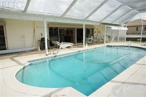 The heated pool is surrounded by a large deck and lanai. Perfect for all weather enjoyment