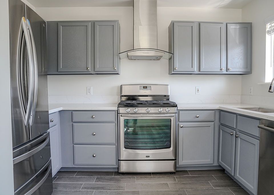 Spacious kitchen with stainless steel appliances.