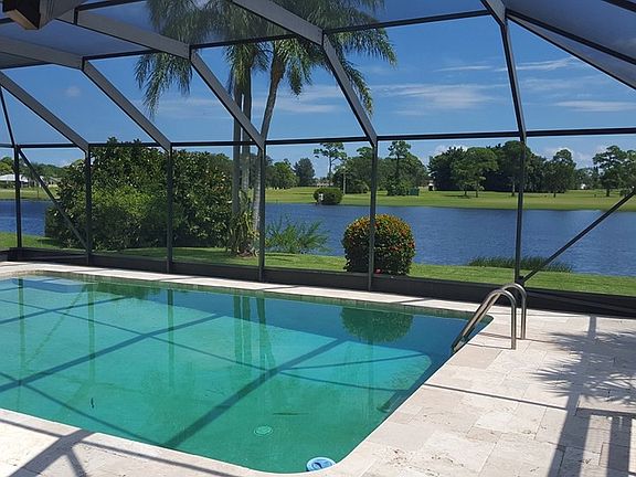 View of pool, lake , and golfcourse