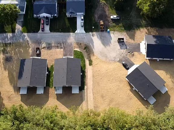 Overview- 4 townhouses/8 units total. Fresh new grass planted. Driveways have been laid.
