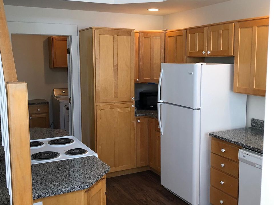 Kitchen with new granite countertops, sink, faucet and flooring. All appliances have been replaced in the past year or two.