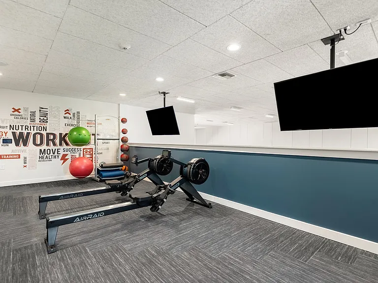 Private Fitness Studio Featuring Rowers, Medicine Balls, and Yoga Equipment