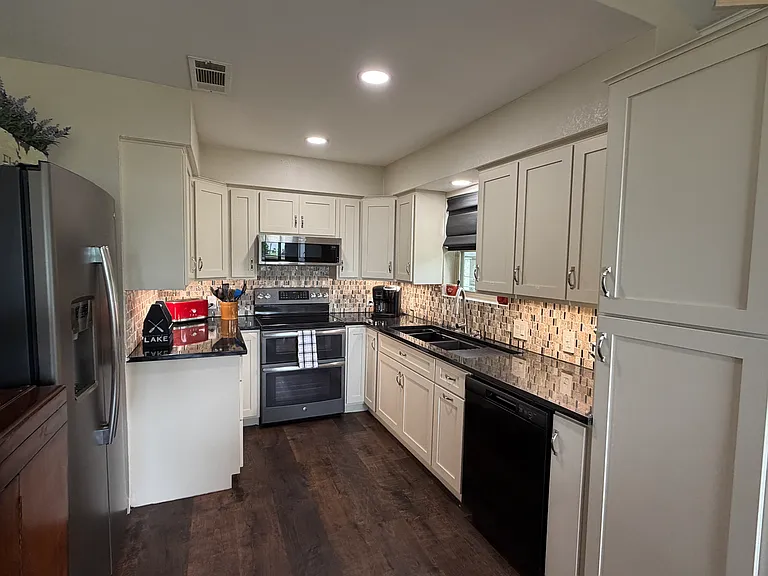 New custom kitchen cabinets, granite countertops, double oven and microwave