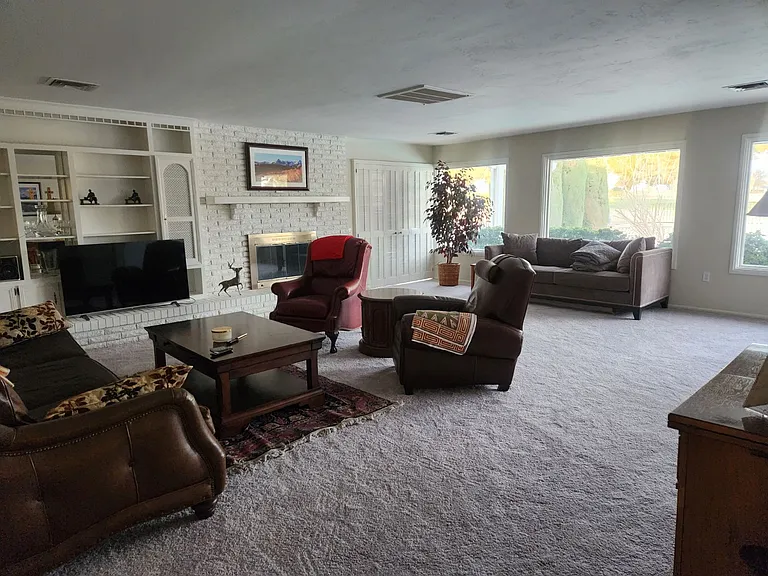 Family room with wood-burning fireplace