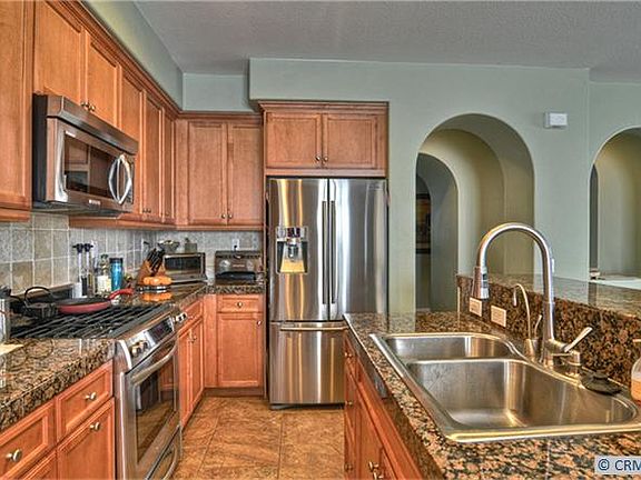 Granite Counters, Center Island with Breakfast Bar, Tile Floors, Custom Backsp