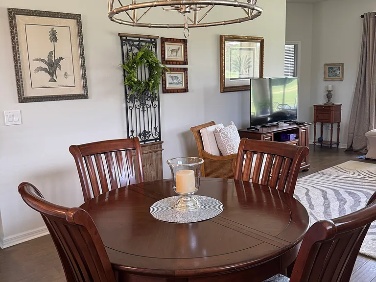Dining area with Ballard design light fixture.